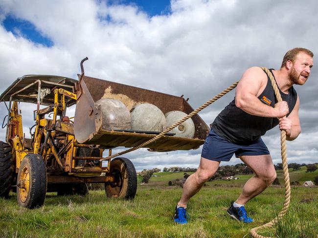 Strong Man Vernon Van Schalkwyk, 25, from Geelong, gets in a little training for the Royal Melbourne Show. Picture: Mark Stewart