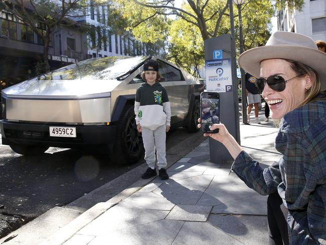 Rona Peylan gets a photo of six-year-old Michael Paylan with the Cybertruck. Picture: John Appleyard