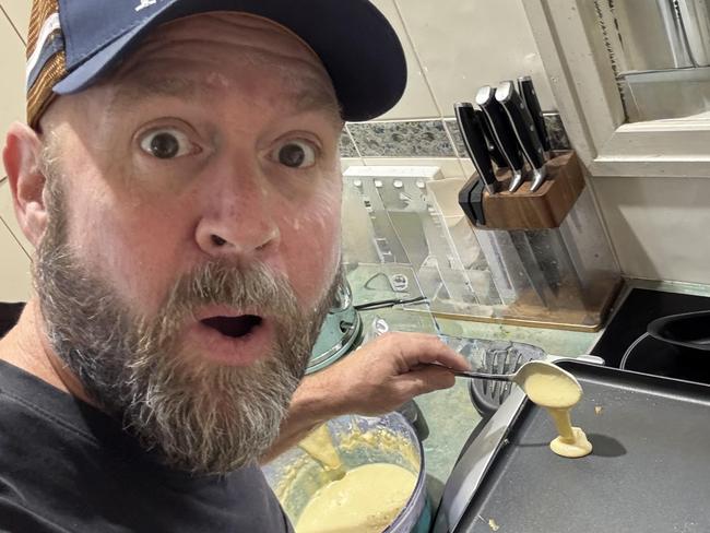 Mal Dodt pointing to his award-winning pikelets