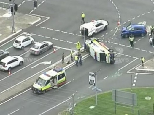 An ambulance vehicle has rolled after a crash at the Albany Creek Rd-Beckett Rd intersection in Bridgeman Downs on Tuesday morning. Picture: 7 News Brisbane