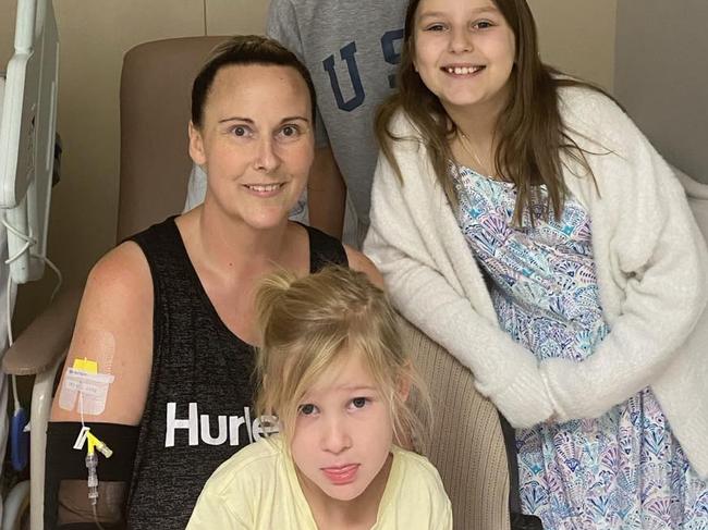 Samantha Bovingdon, 43, thought she was experiencing muscle pain followinga car crash, but the pain was actually bowel cancer. With her daughters 13-year-old Dakota, nine-year-old Darcy and three-year-old Dayna. Picture: Supplied byfamily