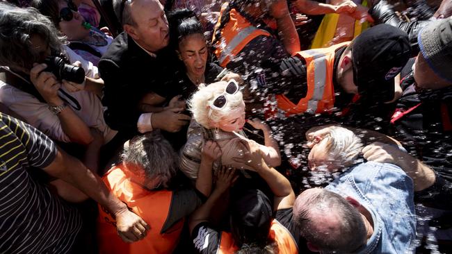 British activist Kellie-Jay Keen-Minshull aka Posie Parker is escorted from Albert Park in New Zealand.