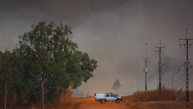 Police block the road as a dangerous fire threatened homes in the Litchfield/Batchelor Area Picture GLENN CAMPBELL