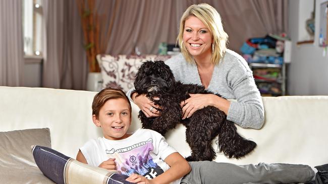 Rozz Switzer and son Hudson, 11, with their cavoodle 'Bullet'. Picture: (AAP IMAGE / Troy Snook)