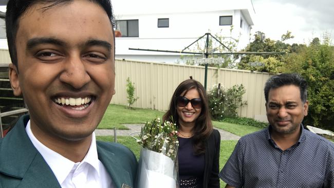 Reena and Munesh Singh pay tribute to their son Rahul, 19, after his body was found four days after a large-scale search in Mount Annan.