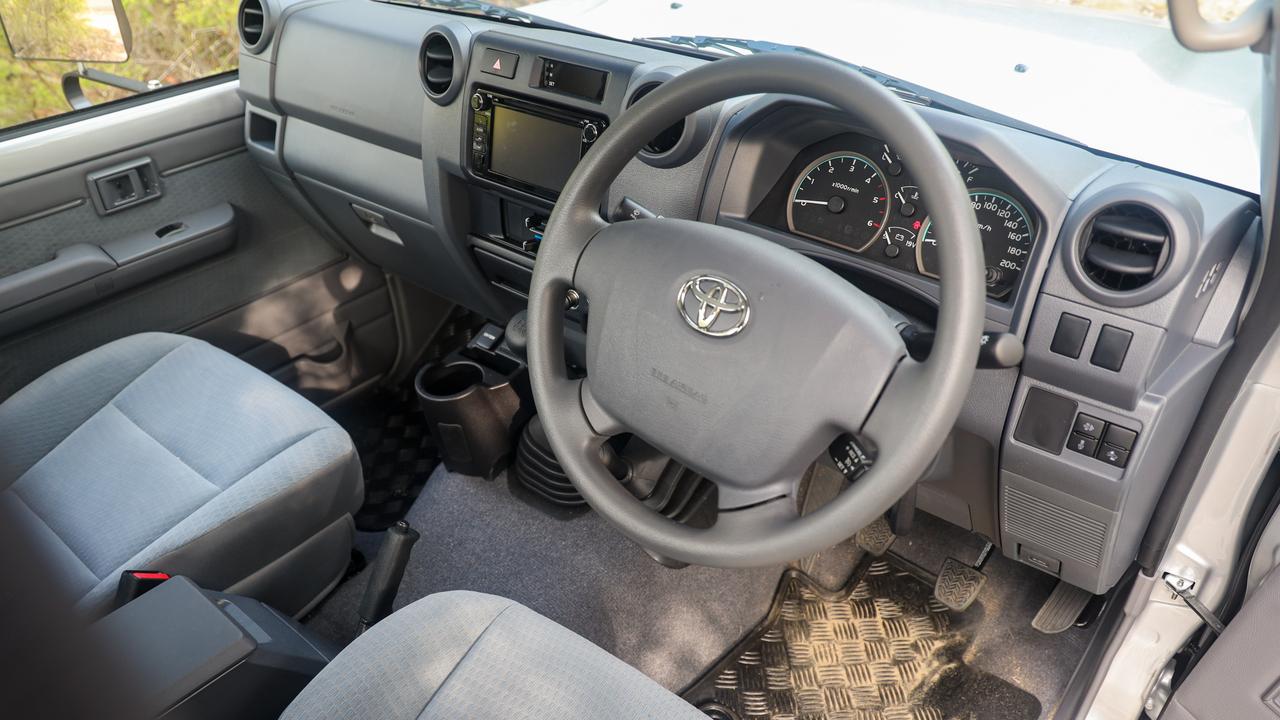 The LandCruiser’s cabin is a sparse affair. Photo: Toby Hagon