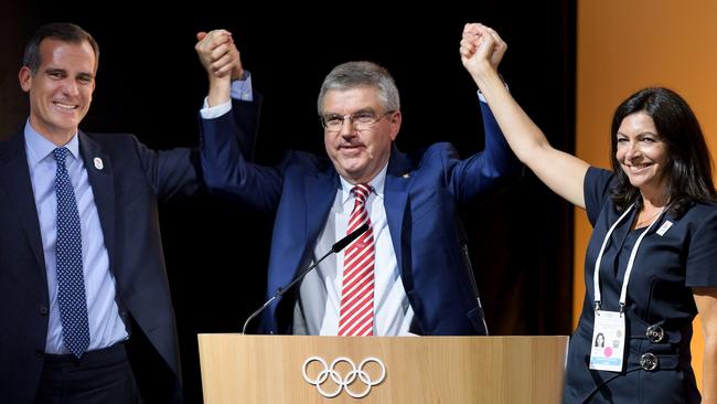 Los Angeles Mayor Eric Garcetti, International Olympic Committee (IOC) President Thomas Bach and Mayor of Paris Anne Hidalgo.