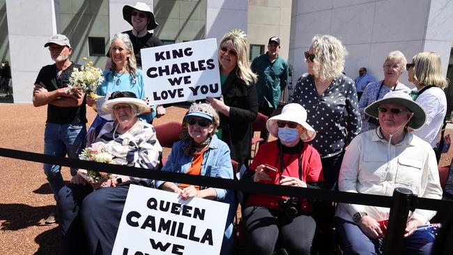 People wait to see King Charles III and Queen Camilla outside Parliament House on October 21, 2024 in Canberra, Australia. Picture: David Gray-Pool/Getty Images