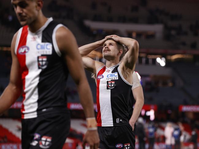 Dejected St Kilda players walk from the ground after losing to the Brisbane Lions. Picture: Darrian Traynor/Getty Images.