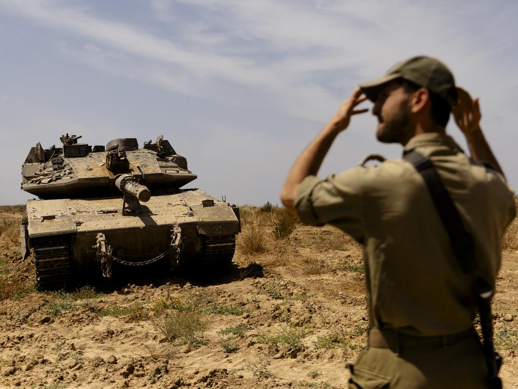 An Israeli soldier directs a tank near the border with the southern part of the Gaza Strip on May 2, 2024 in Southern Israel, Israel. Picture: Amir Levy/Getty Images