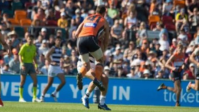 Shane Mumford nearly kills Mitch Duncan.