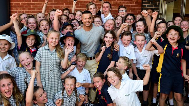 Adelaide-born singer Guy Sebastian with Kings Baptist Grammer School students after an impromptu mini concert at his old school at Wynn Vale. Picture: Bianca De Marchi