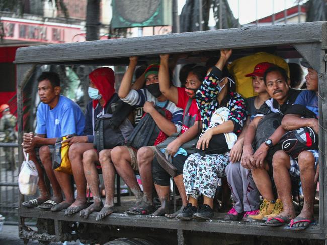 Residents are evacuated as heavy ash and debris from the Taal volcano eruption continues to fall. Picture: AP