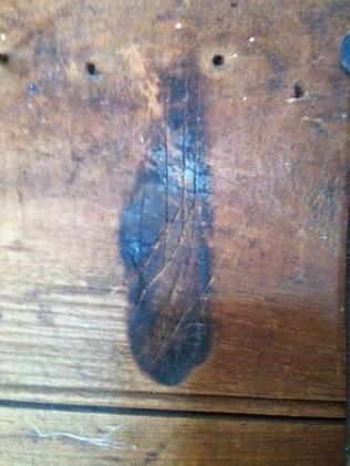 One of many flame-shaped ritual magic burn marks in the tack room at Shene, Tasmania, applied to protect the home from evil spirits.