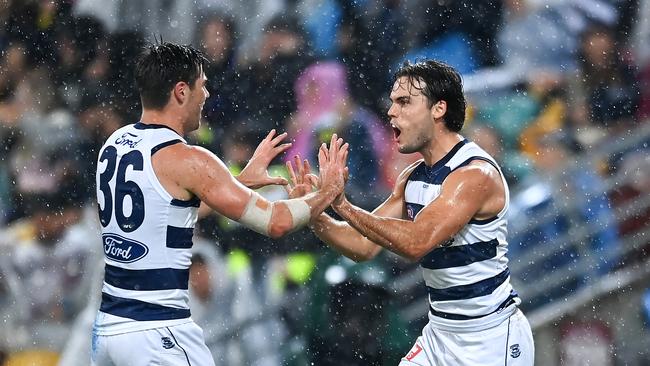 Jack Bowes and Ollie Henry celebrate a goal. Picture: Albert Perez/AFL Photos via Getty Images