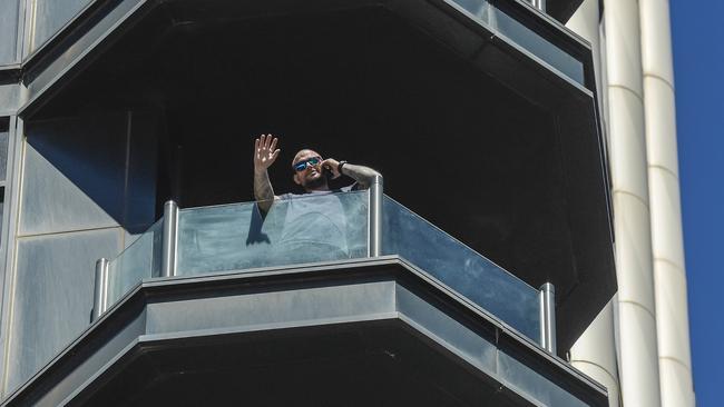 One of the Peppers guests waves from his balcony. Picture: NCA NewsWire / Roy VanDerVegt.