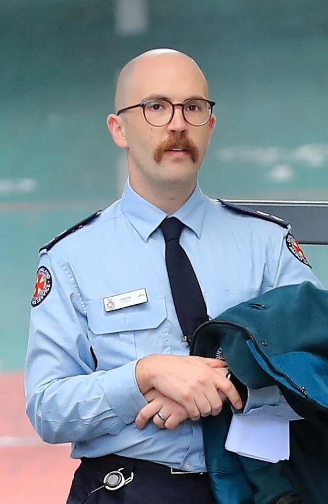 Queensland Ambulance Officer Tyrone Attard leaves court after giving evidence. Photo: Scott Powick