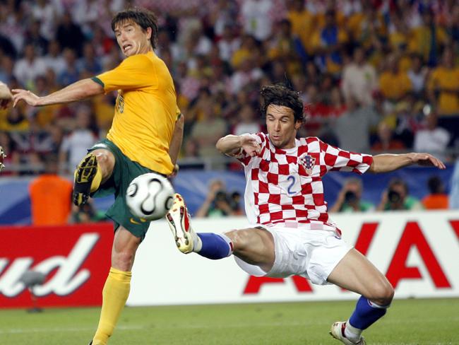 Kewell, left, scores his side's second goal against Croatia's Darijo Srna, right, during the Croatia v Australia Group F soccer match in Stuttgart, Germany. Picture: AP