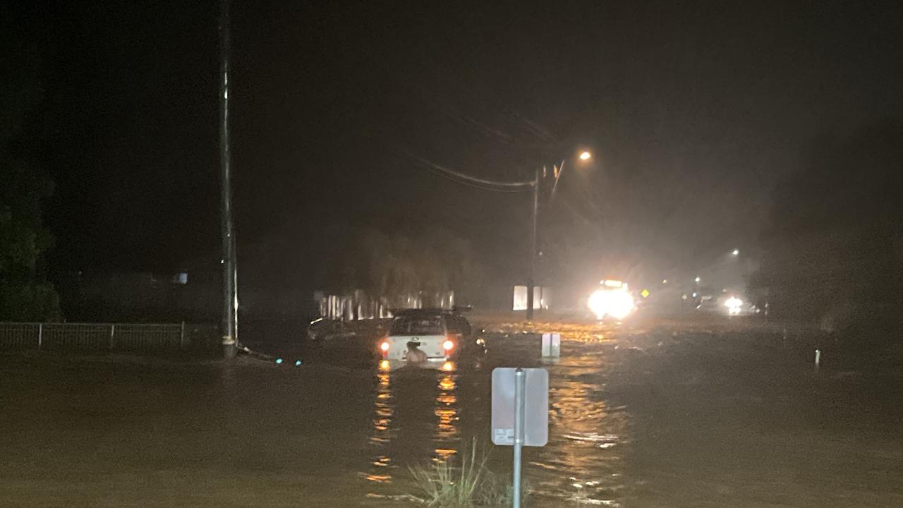 McGregor Road, Smithfield on Tuesday 1AM February 4. Residents try to drive through flood waters. Picture: QPS