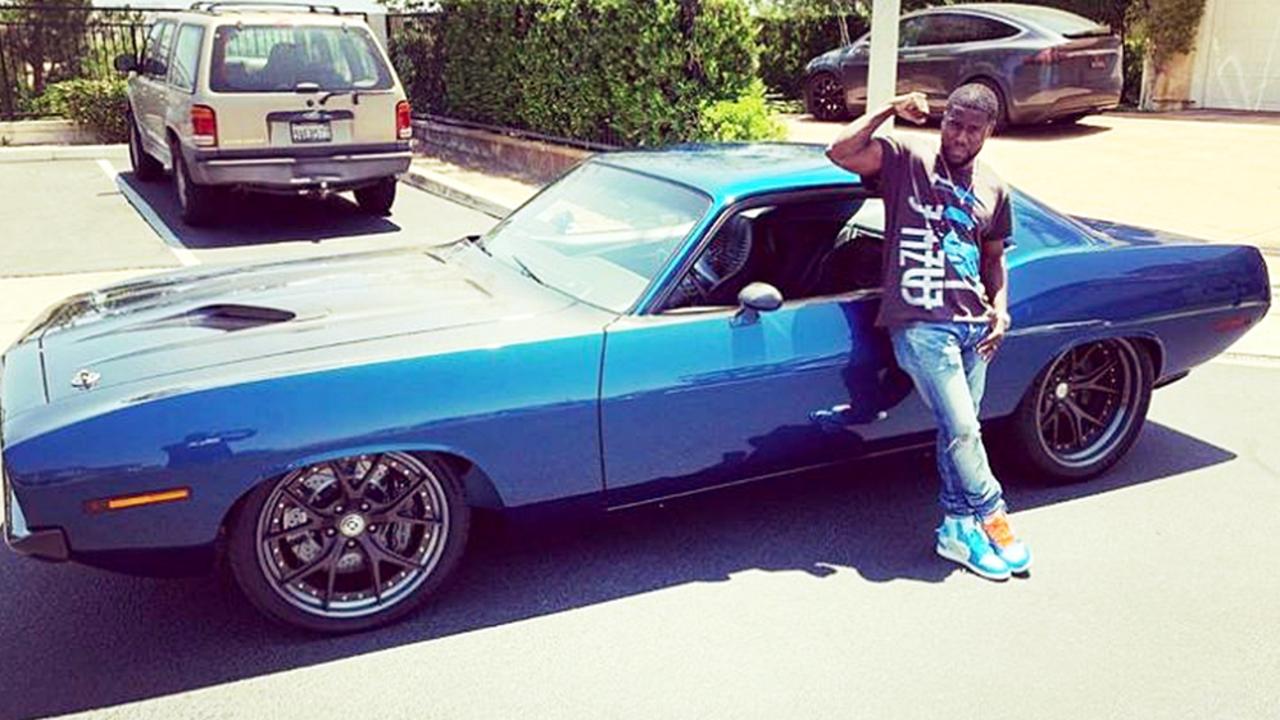 Kevin Hart with his car that was involved in the serious accident near his home. Picture: Instagram