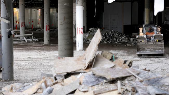 March 2023: Workers on site during the demolition of Eagle Street Pier. Picture: Steve Pohlner
