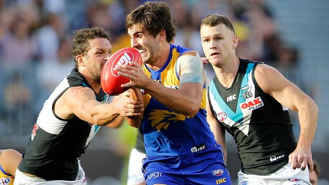Andrew Gaff of the Eagles looks to break a tackle by Travis Boak of the Power.