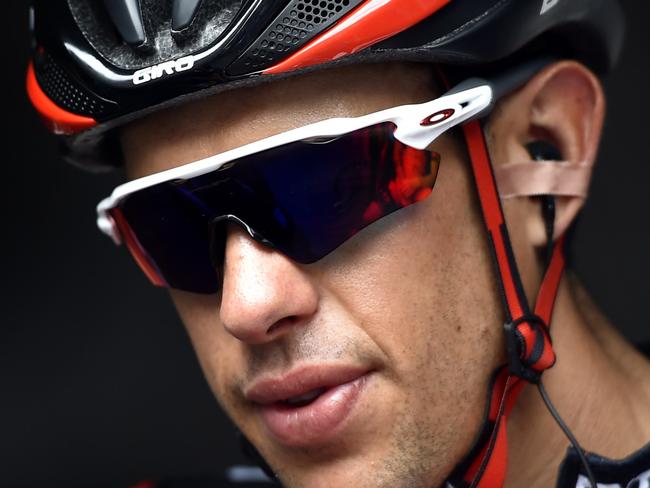 BMC's Richi Porte relaxes prior to the start of stage 3 of the Tour Down Under cycling race from Glenelg to Campbelltown in Adelaide on January 21, 2016. AFP PHOTO / DAVID MARIUZ IMAGE STRICTLY FOR EDITORIAL USE - STRICTLY NO COMMERCIAL USE