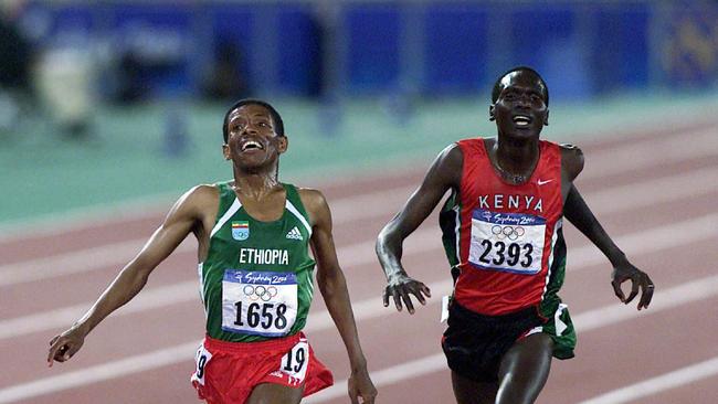Athletics - Ethiopian athlete Haile Gebreselassie winning mens 10000m race with Paul Tergat coming second at Sydney 2000 Olympic Games. a/ct