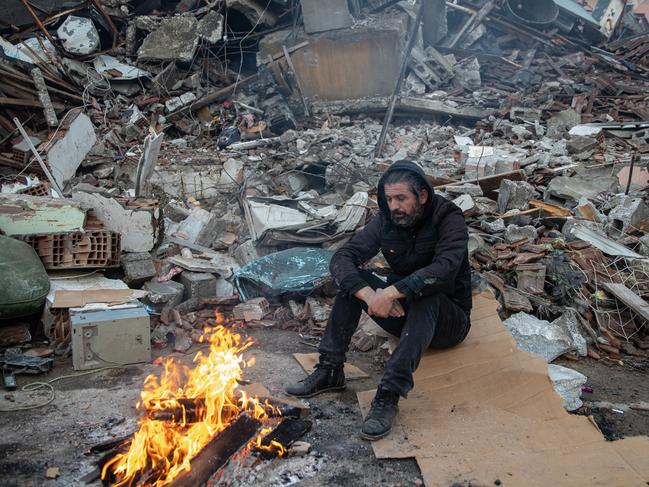 A man waits for news of his loved ones, believed to be trapped under collapsed building in Hatay, Turkey. Picture: Getty Images