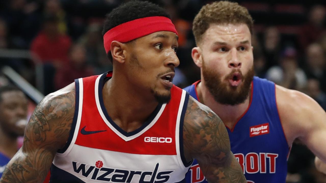 Bradley Beal drives around Detroit Pistons forward Blake Griffin and travels … a lot. AP Photo/Carlos Osorio
