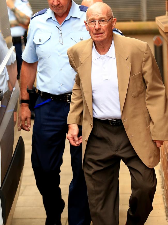 Roger Rogerson is lead from the Supreme Court, during his trial for the murder of Jamie Gao. Picture: Adam Taylor