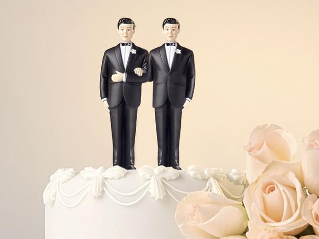 Wedding cake topper and flowers. Gay marriage. Same-sex marriage. Male figurines. Generic image. Thinkstock