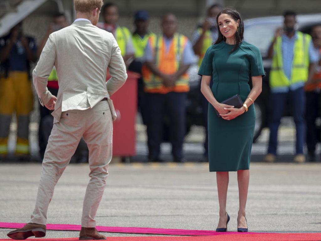 Leaving Fiji in a green dress by American designer Jason Wu. Picture: Ian Vogler/Pool Photo via AP