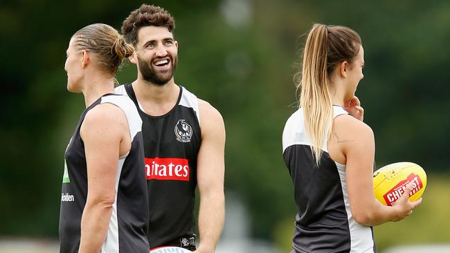 Alex Fasolo shares a laugh with Meg Hutchins at Collingwood training.