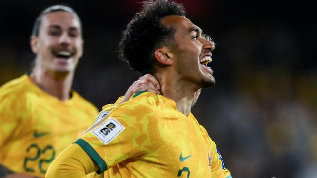 ADELAIDE, AUSTRALIA - OCTOBER 10: Nishan Velupillay of the Socceroos  celebrates after scoring his teams third  goal with  Riley McGree of the Socceroos   during the third round FIFA World Cup 2026 Qualifier match between Australia Socceroos and China PR at Adelaide Oval on October 10, 2024 in Adelaide, Australia. (Photo by Mark Brake/Getty Images)