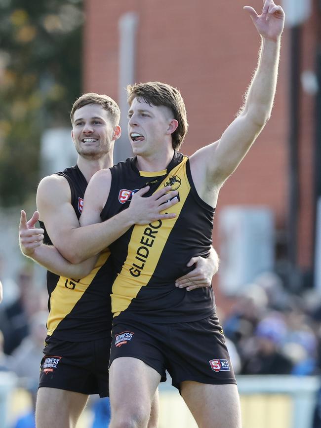 Tigers ruckman Cam McGree is congratulated by teammate Jonty Scharenberg after kicking a long goal against the Double Blues. Picture: SANFL Image/David Mariuz