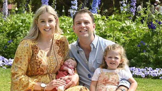 Abbey and Matthew Boulus with daughters Charlotte and 10-day-old Sophie.