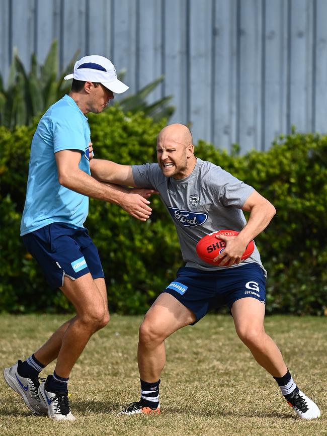 Gary Ablett fends off Andrew Mackie in the hub. Picture: Quinn Rooney/Getty Images