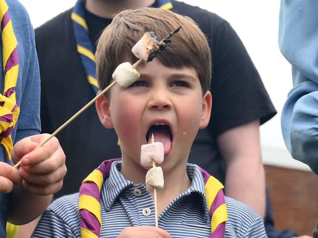 Prince Louis of Wales eats marshmallows as he takes part in the Big Help Out, during a visit to the 3rd Upton Scouts Hut in Slough, England. Picture: Getty Images