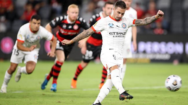 Melbourne City’s Jamie Maclaren kicks a penalty goal against the Western Sydney Wanderers at Bankwest Stadium. Picture: Getty Images
