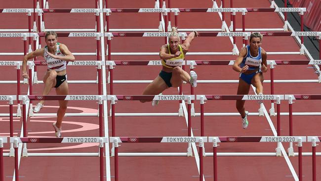 Australia's Liz Clay (centre) is through to the semi-finals of the women’s 100m hurdles. Picture: AFP