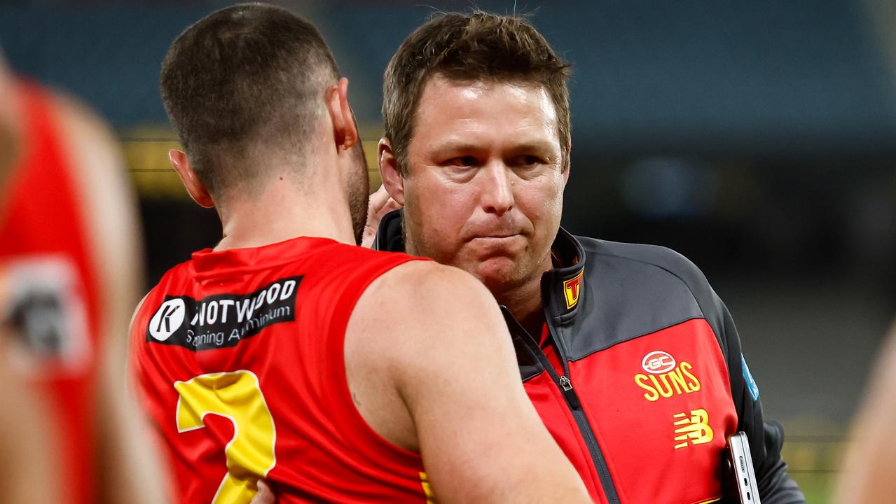 Stuart Dew embraces his players after a win. Picture: Dylan Burns