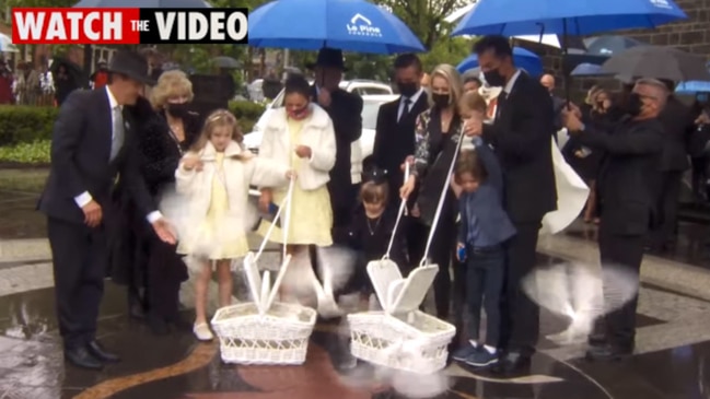 Grandchildren release doves at Bert Newton's state funeral