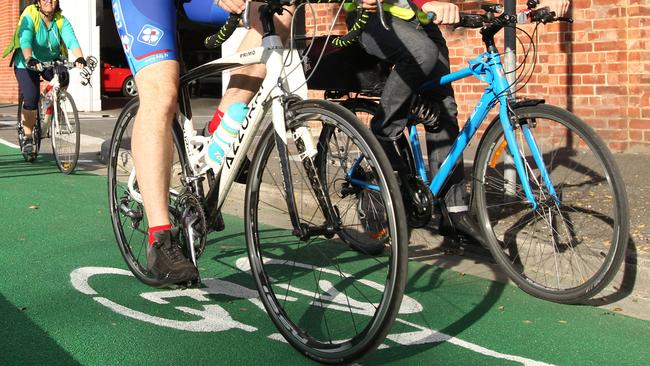 14/05/14 Cyclists riding bikes in the Bike Lane on Frome Street, between Flinders Street and Wakefield Street, Adelaide this morning. Bike Lane opens on Frome Street, City. Picture Stephen Laffer