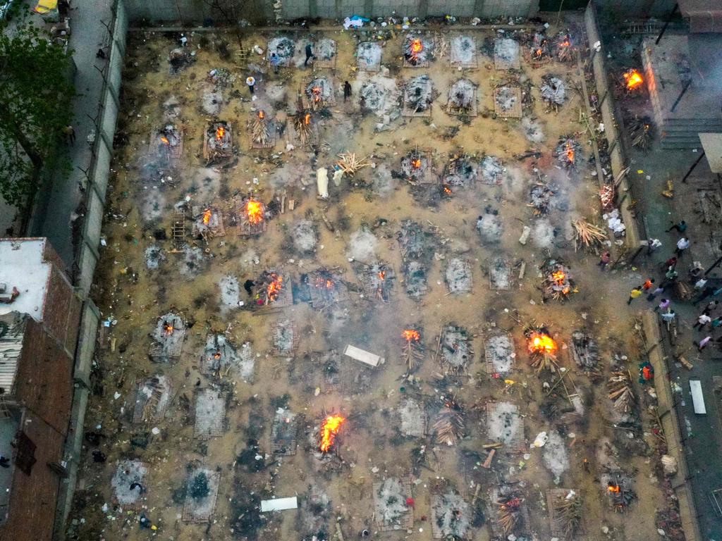 Crematoriums can’t keep up with the growing dead as mass cremations are held in New Delhi, India. Picture: Jewel Samad/AFP