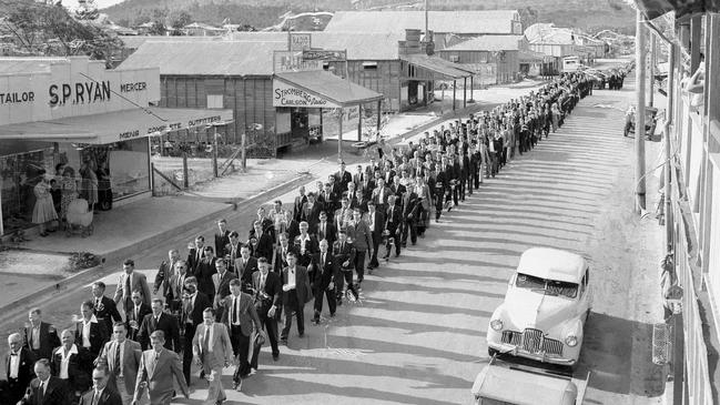 News 14 /10/ 1954 The traditional procession of miners precedes the cortege through Collinsville's main street at the funerals of the seven victims killed by poisonous gas in the mine disaster of 13 Oct 1954. Picture by Fred Carew