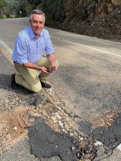 Darren Chester on the pothole riddled Great Alpine Road. Picture supplied