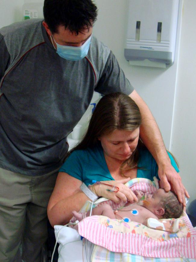 Devastated parents Jason and Tracy Carroll with Ella before she died from CMV.