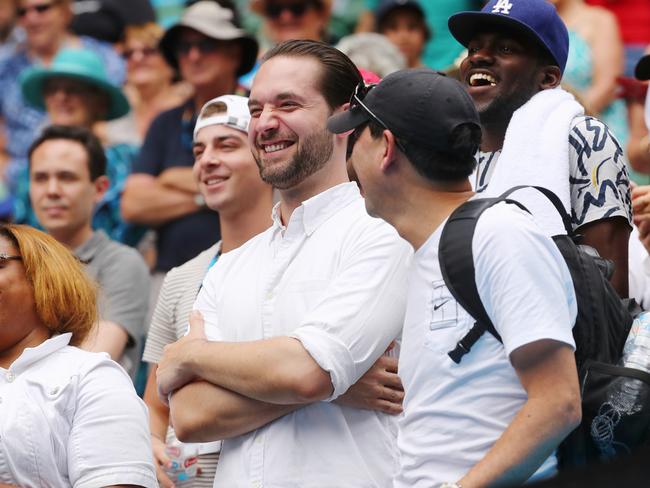 Serena Williams’ fiance Alexis Ohanian smiles during her post-match interview.