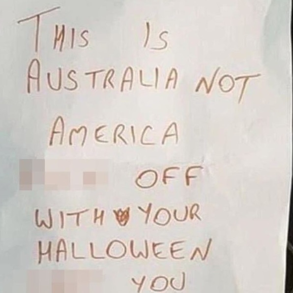 A warning was issued earlier this week to hopeful trick or treaters via a note held up by a peg on a screen door. Picture: X.